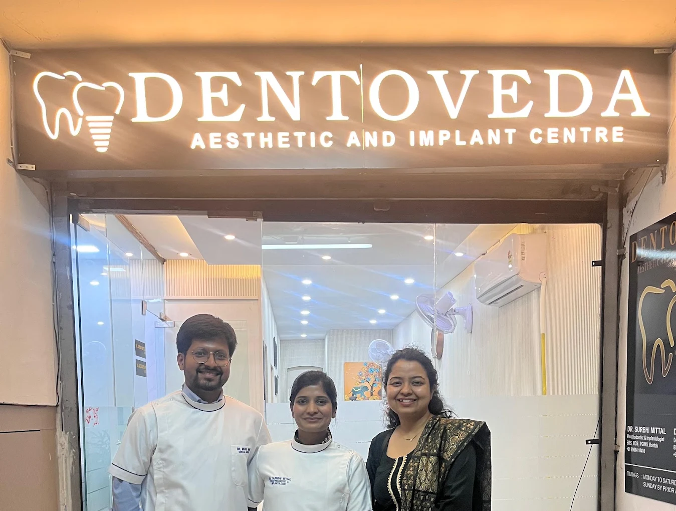 Dentoveda dental clinic team at the clinic entrance